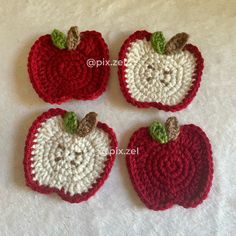 three crocheted apples sitting on top of a white table next to each other