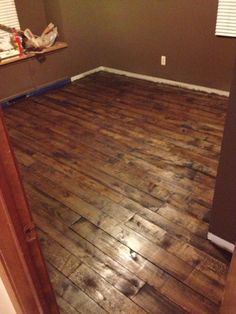 an empty room with hard wood flooring in the process of remodeling