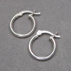 This listing is for one pair of sterling silver hoop earrings. The hoops measure 14mm (about 1/2 of an inch) and is 2mm thick. Most of my dangles will slide easily onto these hoops. MORE INTERCHANGEABLE EARRINGS: https://www.etsy.com/shop/TheDangleDiva?ref=hdr_shop_menu&section_id=20069837 MORE Dangles and Pendants: http://www.thedanglediva.etsy.com FOLLOW me: www.facebook.com/thedanglediva for new designs and discount coupons INTERCHANGEABLE EARRINGS: https://www.etsy.com/shop/TheDangleDiva Small Hoop Earrings With Sterling Silver Clasp In Silver, Adjustable Nickel-free Round Huggie Earrings, Small Hoop Hypoallergenic Earrings For Anniversary, Nickel-free Small Hoop Earrings For Anniversary, Gift Small Hoop Huggie Earrings With Sterling Silver Clasp, Small Hoop Sterling Silver Earrings With Lever Back, Sterling Silver Clasp Small Hoop Huggie Earrings As Gift, Small Hoop Earrings With Sterling Silver Clasp For Anniversary, Silver Small Hoop Huggie Earrings