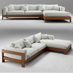 a white couch with lots of pillows sitting on it's back and side ends