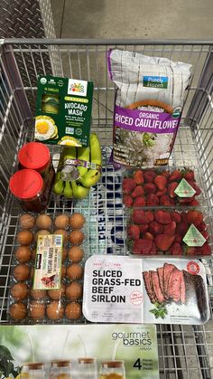 a shopping cart filled with lots of food