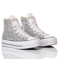 Converse All Star Platform Glitter Silver, the trainer for women has had a makeover. Covered in silver glitter on both the outer and inner sides, because glitter is never enough, your feet deserve to shine to the max. The Converse All Star Platform Glitter Silver comes with its original white laces. For added comfort, we offer you our heel lift insole, which, in addition to comfort, gives you a few extra centimetres and an immediate figure-enhancing boost. Converse All Star Platform, All Star Platform, Converse Platform, Tiktok Shop, Never Enough, Saint Laurent Shoes, Fabulous Shoes, Sneaker Wedge, Converse All Star