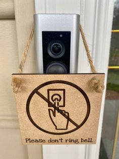 a door hanger with a sign saying please don't ring bell