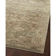 a large rug with an ornate design on the top and bottom, in beige tones