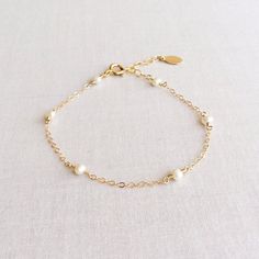 Dainty Pearl Bracelet Pearl Bracelet Gold Pearl Bracelet | Etsy Adjustable Pearl Charm Bracelet For Bridesmaids, Adjustable Pearl Bracelet For Bridesmaids, Pearl White Bracelets With Pearl Charm For Bridesmaids, Adjustable Pearl Drop Bracelet For Bridesmaids, Dainty Wedding Jubilee Charm Bracelet, Pearl Charm Bracelet For Bridesmaid Gift, Pearl Charm Bracelet For Bridesmaids, Dainty Hypoallergenic Charm Bracelet For Weddings, Classic Pearl Bracelet With Extender For Gift