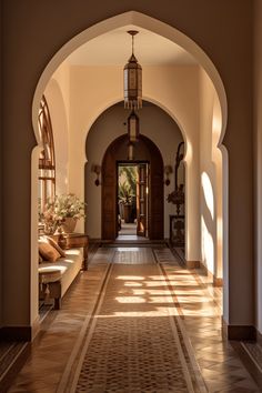 an archway leading to a hallway with potted plants on either side and benches in the middle