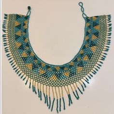 New Broad Collar Beaded Necklace. The Beautiful Colors Of This Piece Will Enhance Any Of Your Outfits. It Is A Beautiful, Highly Detailed Accessory That Will Have Everyone Look At Itegyptian Style. Turquoise Beaded Necklace With Dangling Round Beads, Handmade Turquoise Bohemian Bib Necklace, Adjustable Turquoise Beaded Bib Necklace, Turquoise Bib Necklace With Round Beads For Gifts, Bohemian Multicolor Turquoise Necklace With Faceted Beads, Bohemian Turquoise Bib Necklace With Colorful Beads, Bohemian Faceted Beads, Beaded Turquoise Necklace With Round Beads For Festival, Beaded Turquoise Necklace For Festival