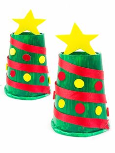 two green and red paper cups with yellow stars on top, one is decorated like a christmas tree