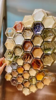 an array of spices and seasonings arranged in hexagons