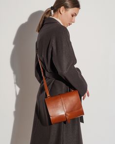 Minimalist leather crossbody bag for women. Small crossbody purse size 10 inch/8 inch ( 25 cm/20 cm) Features: - Made of premium quality vegetable tanned cow leather. - The purse is made with two compartment. - Without lining. - Adjustable strap. Size 10 inch / 25 cm 8 inch / 20 cm 3,2 inch / 8 cm Handle length can be adjusted from 43 inch to 53 inch (110 cm to 135 cm). It is perfect for women and girls for everyday wear and as an evening bag. This crossbody purse is versatile and easy to carry, Minimalist Shoulder Bag With Leather Lining For Work, Minimalist Leather-lined Shoulder Bag For Work, Minimalist Workwear Shoulder Bag With Leather Lining, Minimalist Brown Shoulder Bag For Formal Occasions, Classic Everyday Saddle Bag For Fall, Fall Smooth Grain Satchel Shoulder Bag, Minimalist Leather-lined Satchel Shoulder Bag, Leather Flap Bag For Everyday Fall Use, Modern Flap Bag For Everyday Use In Fall