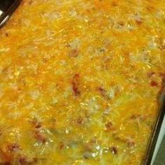 a casserole dish with cheese and meat in it on a stove top oven