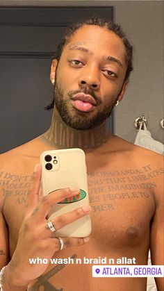 a man with no shirt on taking a selfie in front of a mirror holding a cell phone