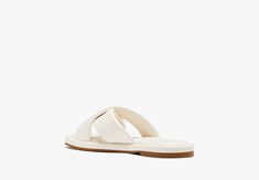 Find your paradise with our Rio slides. Made from faux leather these sandals take you from the pool to happy hour with ease… | Kate Spade Rio Slide Sandals, Cream - 8 White Leather Slippers For Vacation, White Synthetic Sandals For Poolside, Chic Slide Slippers For Vacation, Chic Synthetic Slippers For Vacation, Chic Synthetic Vacation Slippers, White Slide Sandals For Poolside, White Synthetic Sandals For The Pool, White Synthetic Sandals For Pool, White Open Toe Sandals For Pool