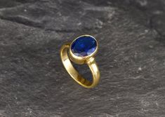 Gold Sapphire Ring set with a Created Sapphire in a perfect diamond cut & deep blue color, at 10x8mm, 3 Carats.Antique Ring design made of Gold Vermeil ☞ thickest 18k Gold Plating on top of Solid 925 Sterling Silver ☞ made to last.Matching Earrings & Matching Pendant - please ask me☞ Choose your size ☞ I resize (before shipping) for FREE to Any size*⌛Last Rings left ⌛ Details : ♥ Each item comes in a cute GIFT BOX ✓ ♥ GUARANTEE on the materials ✓♥ Created Sapphire in a deep blue color ✓♥ Oval Sapphire Ring As Gift, Blue Oval Ring With Bezel Setting, Oval Sapphire Ring Gift, 14k Gold Solitaire Sapphire Ring, Gold Sapphire Oval Cabochon Ring, Oval Sapphire Signet Ring Hallmarked, 14k Gold Oval Cabochon Sapphire Ring For Gift, 14k Gold Round-cut Sapphire Ring, Oval Sapphire Ring