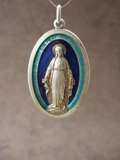 Large Vintage Catholic Miraculous Medal with 2 tone blue enamel (NOS) This beautiful medal measures 26x42mm or 1 1/2 tall. Its quite large and heavy in weight. The front is a very detailed image of the Virgin Mary. There are 2 different colors of blue enamel around her. Around the edge is the The Virgin Mary, Miraculous Medal, Pray For Us, Mother Mary, Religious Art, Detailed Image, Virgin Mary, Collectable Items, Different Colors