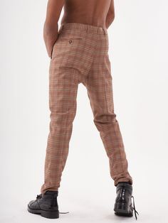 These coffee-colored pants come in a slim fit, with a tapered leg for maximum style. They're also super comfortable, with a stretchy waistband and functional side pockets. Plus, they're versatile - they look great with both tucked-in and untucked tops. FEATURES- Cotton-stretch- Button, hook & zip fastening- Four pockets- Premium Italian fabric- Hand crafted- Designed in Los Angeles SIZE GUIDEModel's height and weight: 5"11 feet & 172 lbs. (180cm & 78kg)Model wears size: 32 FIT GUIDEFits true to Urban Clothing, Colored Pants, Coffee Colour, Italian Fabric, Urban Outfits, The Urban, Height And Weight, Design Crafts, Parachute Pants