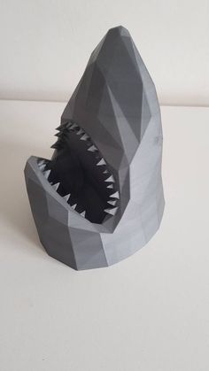 a paper sculpture of a shark with its mouth open