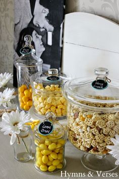 there are many different types of candies in glass jars