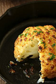 a close up of a piece of food in a pan with broccoli on it