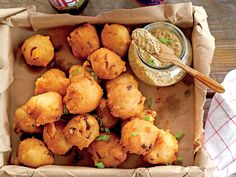 fried food on a tray with dipping sauce