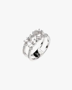 - Baguette cut gemstone for fashion ring- Made in Sterling silver set with a high-quality Cubic Zirconia. - Stone size: Baguette-cut 3 mm x 1.50 mm / Round cut 1.50 mm, 1.10 mm - Bandwidth: 8 mm Sterling silver925 Sterling Silver is an alloy made of 92.5% pure silver and 7.5% copper. We plate our silver jewelry in rhodium, which gives it extra shine and durability. Rhodium is one of the costliest precious metals due to its rarity.CareH2O sensitive. Avoid water when wearing your piece, because ov Modern Silver Diamond Ring With Baguette Diamonds, Silver Baguette Diamond Rings, Silver Baguette Ring Fine Jewelry, White Gold Open Ring With Baguette Diamonds, Sterling Silver Rings With Baguette Diamonds In Diamond White, Silver Baguette Cubic Zirconia Jewelry, Silver Baguette Diamond Rings Fine Jewelry, Dazzling Cubic Zirconia Baguette Cut Ring, Silver Rings With Baguette Diamonds