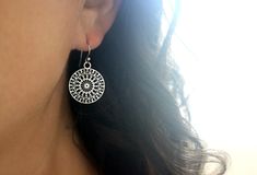 Wispy stainless steel circles have been laser cut with a beautiful mandala spoke design and set on solid stainless steel ear wires to create these dangling hypoallergenic earrings. These lovely lightweight earrings measure approximately 1 inch long and 0.75 inches wide. They are comprised entirely out of stainless steel which is hypoallergenic and safe for most skin types. They are resistant to corrosion and extremely durable. More hypoallergenic stainless steel jewelry is available here: https: Nickel Free Stainless Steel Drop Earrings, Nickel-free Stainless Steel Drop Earrings, Hypoallergenic Round Stainless Steel Earrings, Hypoallergenic Stainless Steel Round Earrings, Nickel-free Stainless Steel Round Earrings, Nickel-free Round Stainless Steel Earrings, Hypoallergenic Round Surgical Steel Earrings, Hypoallergenic Silver Stainless Steel Earrings, Hypoallergenic Dangle Earrings In Stainless Steel