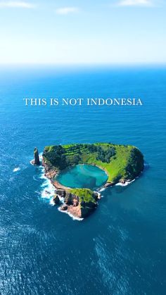 an island in the middle of the ocean with a quote above it that reads, this is not indonesia