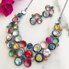 "Statement Necklace Set, Necklace Earring Set, Multicolor Necklace, Chunky Necklace, Necklaces For Women, Bold Colorful Necklace, Jewelry Set Our best selling statement necklace now comes with matching earrings. You asked and I listened. Featuring beautiful sparkling crystals and shimmery enamels this bib style necklace is sure to impress. This piece is so extraordinary you can expect many compliments when wearing this stunning necklace. The necklace and earrings are high quality, nickel free and plated in a gunmetal plating. The necklace is 18\" in length with a 2\" extension and the lightweight stud earrings are approximately 1\" in length." Multicolor Metal Necklace Nickel-free, Nickel-free Multicolor Metal Necklaces, Multicolor Metal Dangle Jewelry, Nickel-free Multicolor Metal Necklace, Eye-catching Multicolor Jewelry For Party, Eye-catching Multicolor Party Jewelry, Multicolor Nickel-free Costume Jewelry, Multicolor Metal Costume Jewelry, Multicolor Metal Jewelry Sets For Party