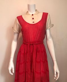 "1940's red and white dotted swiss pinafore dress. Fake pinafore front has a sheer white 'blouse' with Peter Pan collar and shaped turn back cuffed sleeves. Front of sleeve is white, back is dotted swiss. 3 red plastic buttons at center front. Dress has shirred waist, 2 belt loops and a 8 1/2' metal zipper at left side. Skirt fabric has a scalloped stripe of plain red every 3 1/4\". The hem is a selvedge edge, there is no turned up hem. Maker tag has been cut out. No size tag. Good condition. sleeve 6 1/2\" shoulder 5\" shoulder to shoulder 15\" chest 32\" waist 26\" shoulder to waist 13 1/2\" waist to hem 31\" hem 31\" laid flat, 62\" total length 44 1/2\" belt 1 1/4\"w x 63\"l" Retro Swiss Dot Dress For Spring, Fitted Vintage Dress With Peter Pan Collar For Summer, Red 1950s Spring Dresses, Retro Fitted Swiss Dot Dress, Fitted Retro Swiss Dot Dress, Retro Swiss Dot Dress, 1940s Outfits, Plain Red, Sheer White Blouse