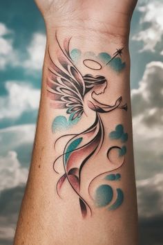 Angel tattoo with wings, halo, and trumpet on forearm with a cloudy sky background. Angles Tattoos For Women, Name With Angel Wings Tattoo, Angle Wings Tattoo Women, Beautiful Angel Tattoos For Women, Guardian Angel Tattoo For Women, Grandma Memorial Tattoos, Guardian Angel Tattoos, Tattoos For Lost Loved Ones, Unique Memorial Tattoos