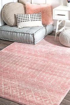 a living room with a couch, chair and rug