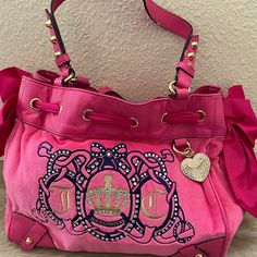 Amazing Juicy Bag In Excellent Condition! Has The Heart Charm With Bling. Super Iconic. Bling On The Bag. Soft Pink Velour. Minor Minor Minor Peeling In Some Of The Leather Areas. Overall This Bag Is Still 10/10 Condition Like The Item But Not The Price? Offers Are Always Accepted! Feel Free To Send An Offer Bundle 2+ Items & You Will Get Sent A Discounted Offer & You Will Save $ On Shipping Poshmark Ambassador Closet In Top Rated Seller Fast Shipping Average Same Day Smoke & Pet Free Home Luxury Recycled Packaging Hot Pink Juicy Couture, Juicy Bag, Mcbling Fashion, Pink Juicy Couture, Juicy Couture Purse, Couture Handbags, Pink Bling, Juicy Couture Bags, Cute Bags