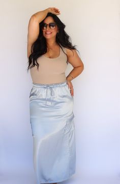 Effortlessly chic and stylish, our Powder Blue Satin Maxi Skirt adds a touch of playfulness to any outfit. Made of luxurious satin, it features cargo pockets and an elastic waist for convenience and comfort. A must-have for any fashion-forward individual! Details: -maxi skirt -elastic waistband -cargo pockets -soft satin material Model: Tara Size: 6-8 Height: 5’0 Weight: 149 Bust: 36” Waist 33” Bra Size: 36 D SIZE BUST WAIST HIPS XS(0-1) 31-32 24-25 34-35 S(3-5) 33-34 26-27 36-37 M(7-9) 35-36.5 Blue Satin Bottoms For Night Out, Casual Satin Lined Skirt, Chic Blue Satin Bottoms, Blue Satin Flowy Skirt, Spring Blue Satin Bottoms, Casual Satin Skirt, Satin Maxi Skirt, Satin Maxi, Cargo Skirt