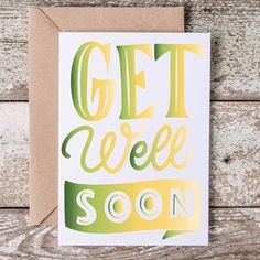 a card with the words get well soon on it