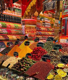 an assortment of fruits and vegetables on display in a store