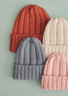 three knit beanies are shown on a gray background