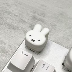 a close up of a keyboard with an animal key board on it's side