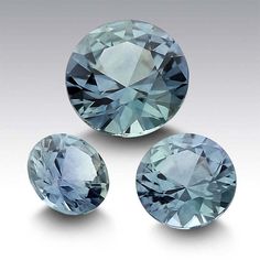 three blue diamonds on a white background