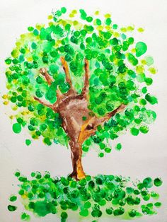 a child's drawing of a tree with green leaves on the bottom and brown trunk