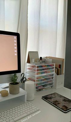 a desktop computer sitting on top of a white desk