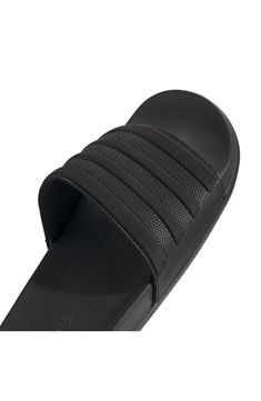 With a cushy insole, this casual slide sandal offers lasting comfort to be a weekend wardrobe favorite. Synthetic upper/textile lining/synthetic sole Imported Black Slip-on Flip Flops For Leisure, Slip-resistant Black Sandals, Black Non-slip Slides For Leisure, Black Synthetic Slide Slippers, Comfortable Black Flip Flops With Cushioned Footbed, Black Cushioned Slide Slippers, Black Slip-on Sandals For Leisure, Black Slip-resistant Slides For Spring, Spring Black Slip-resistant Sandals