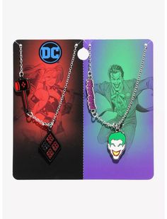 two necklaces with the dc characters on them, one has a key to his chest and