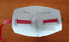 an origami book with measuring tape on it