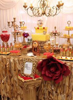 a table topped with lots of cakes and desserts