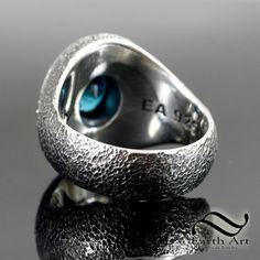 A deep cut blue zircon with a halo of rough cube diamonds and textured silver creates a beautifully masculine setting, a refined and luxurious look while being handsome and rugged in appearance. The Ring: ~The ring is crafted in solid sterling silver and is not hollowed out, it has a hefty feel and weight to it. ~The top bezel and halo channels are all solid 18k yellow gold. This give a rich contrast against the textured and oxidized sterling silver. ~Ring size: 11 (The ring size can be adjusted Blue Zircon, Oxidized Sterling Silver, Ring Sterling Silver, Ring Box, Signet Ring, Sterling Ring, Custom Items, Sterling Silver Ring, Blue Man