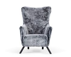 the grey chair is upholstered and ready to be used as a accent piece