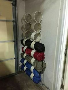 a stack of buckets sitting on top of a metal rack