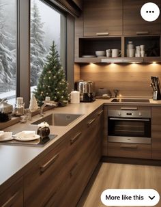 the kitchen is decorated for christmas with lights and decorations on the windowsill, along with a small fir tree