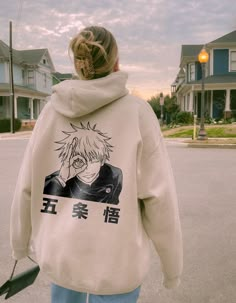 This vintage Gojo Satoru anime hoodie is the perfect anime lover and jujutsu kaisen hoodie. It can be a gift for him or a gift for her. Everyone needs a cozy go-to hoodie to curl up in, so go for one that's soft, smooth, and stylish. It's the perfect choice for cooler evenings! Each hoodie is carefully printed with a hand-drawn illustration and will withstand many washings. To make you feel extra comfy we only use super soft hoodie made from clouds and kissed by baby seals 🦭💋. + Perfect Gift 🎁: Whether you're thinking of a gift for him or her, this vintage anime hoodie is sure to charm any anime lover. Gifting made easy! -- FEATURES: + Long-lasting Quality 🧶: 50% pre-shrunk cotton, 50% polyester. Air-jet spun yarn with a soft feel and reduced pilling. + Harajuku in Every Thread ⛩️: Div Gojo Satoru Anime, Hoodie Design Ideas, Manga Gift, Fan Anime, Trendy Hoodies, Stylish Hoodies, Vintage Anime, Anime Lover, Anime Merch