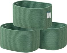 three green round baskets sitting on top of each other